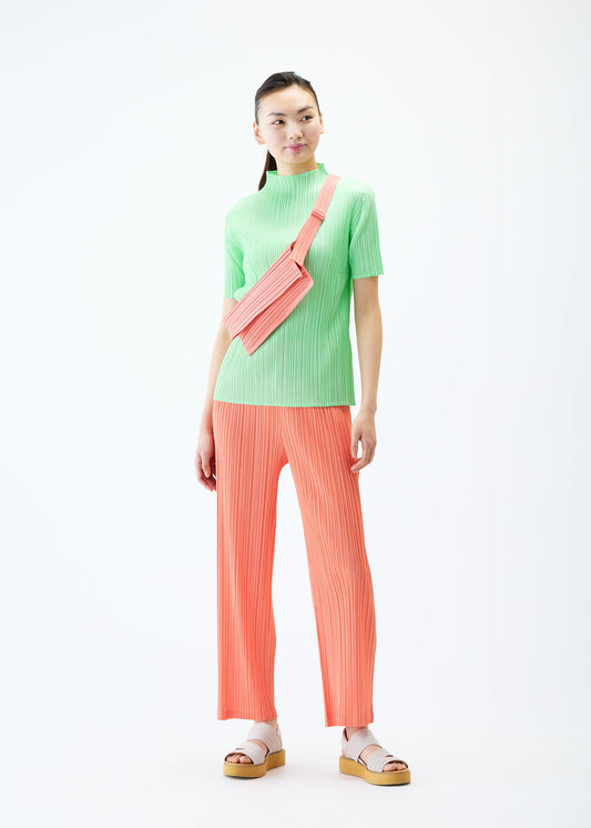 A model wears the PLEATS PLEASE ISSEY MIYAKE PLEATS SACOCHE bag.