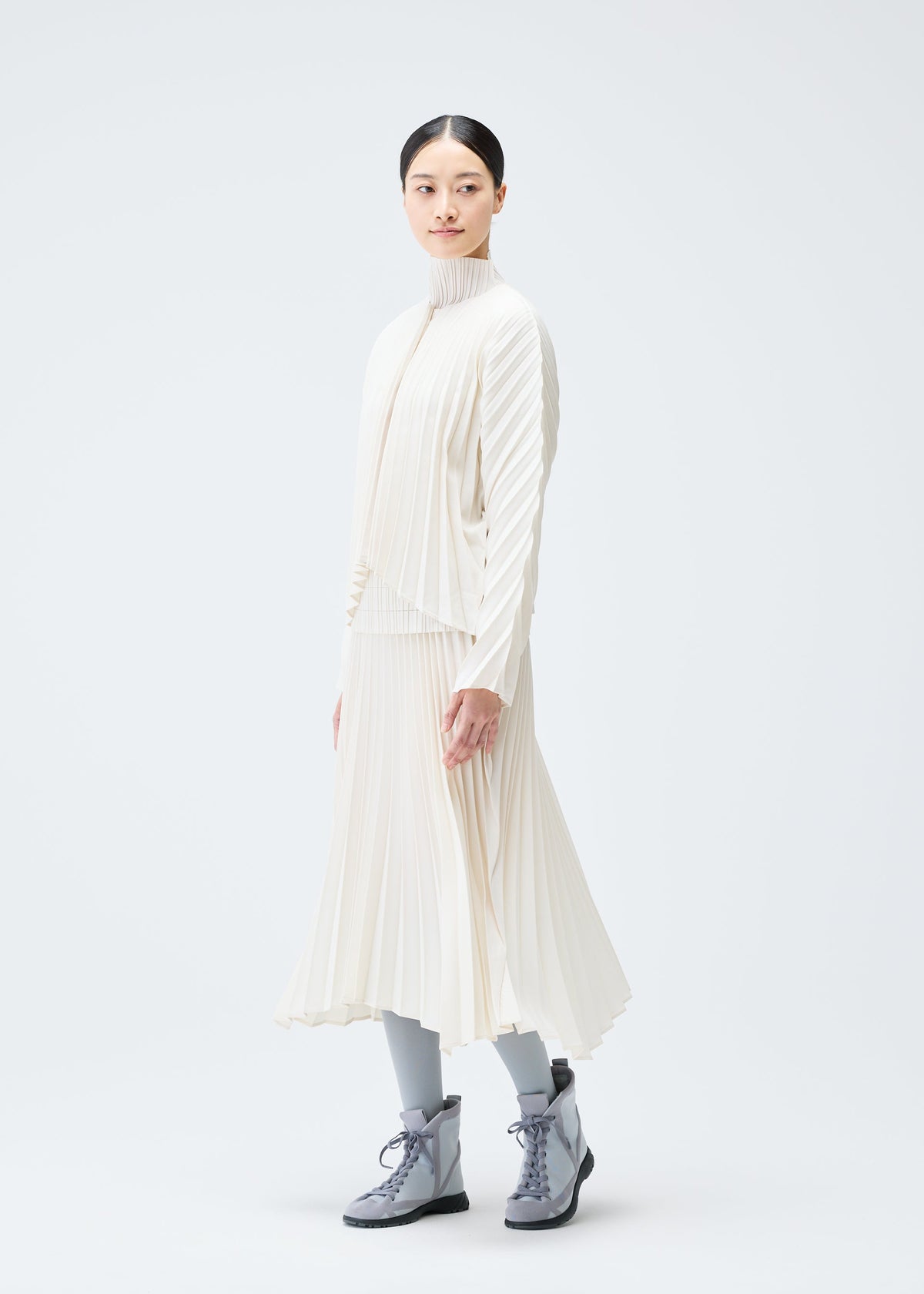 A model wears the PLEATS PLEASE ISSEY MIYAKE CIRCULAR skirt.