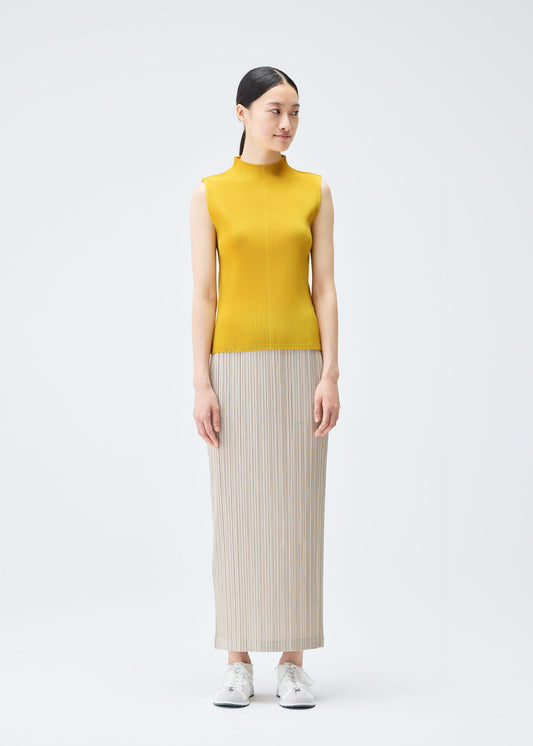A model wears the PLEATS PLEASE ISSEY MIYAKE MIST JULY top.