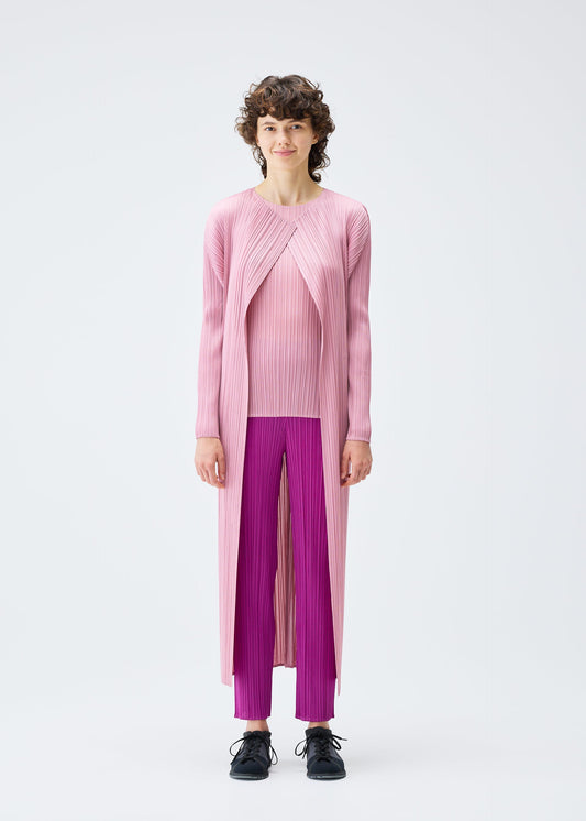 A model wears the PLEATS PLEASE ISSEY MIYAKE MONTHLY COLORS SEPTEMBER coat.