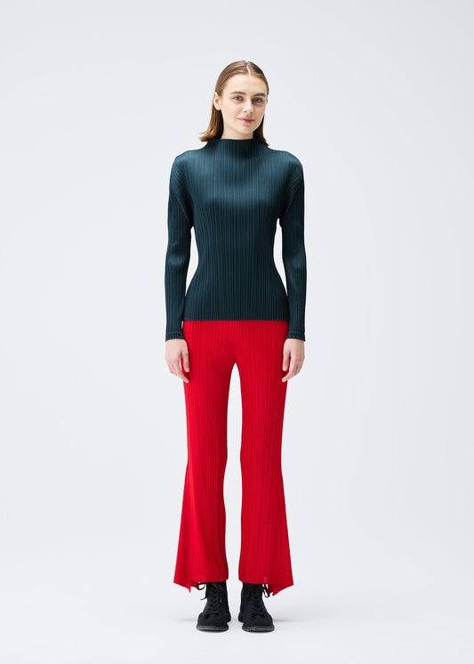 A model wears the PLEATS PLEASE ISSEY MIYAKE OLE! clothing.