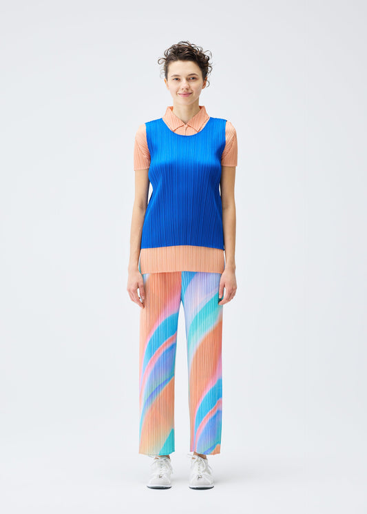 A model wears the PLEATS PLEASE ISSEY MIYAKE GROOVE trousers.