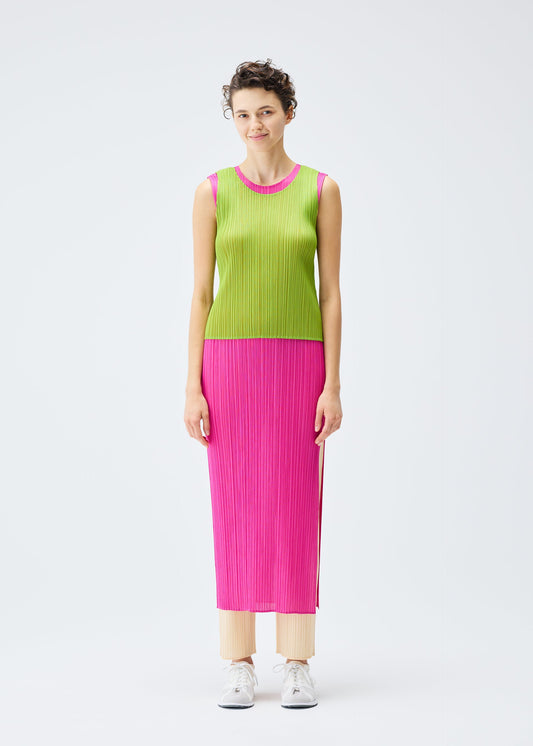 A model wears the PLEATS PLEASE ISSEY MIYAKE LUCID PLEATS dress.