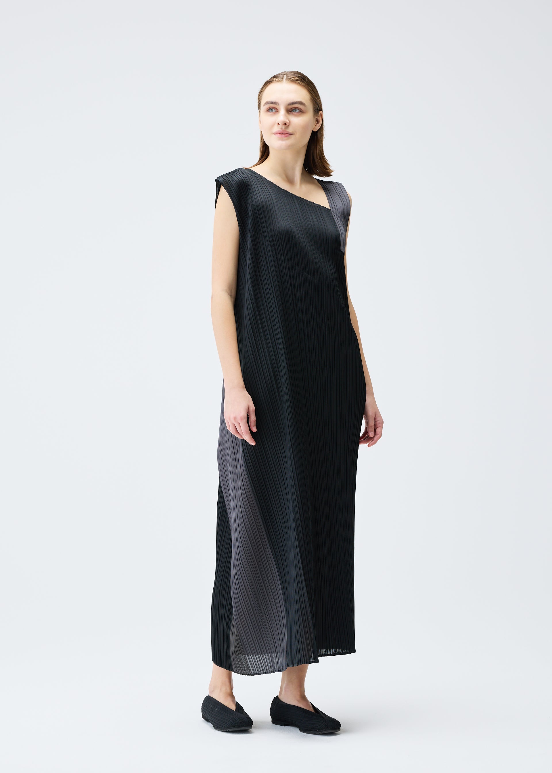A model wears the PLEATS PLEASE ISSEY MIYAKE POINTE dress.