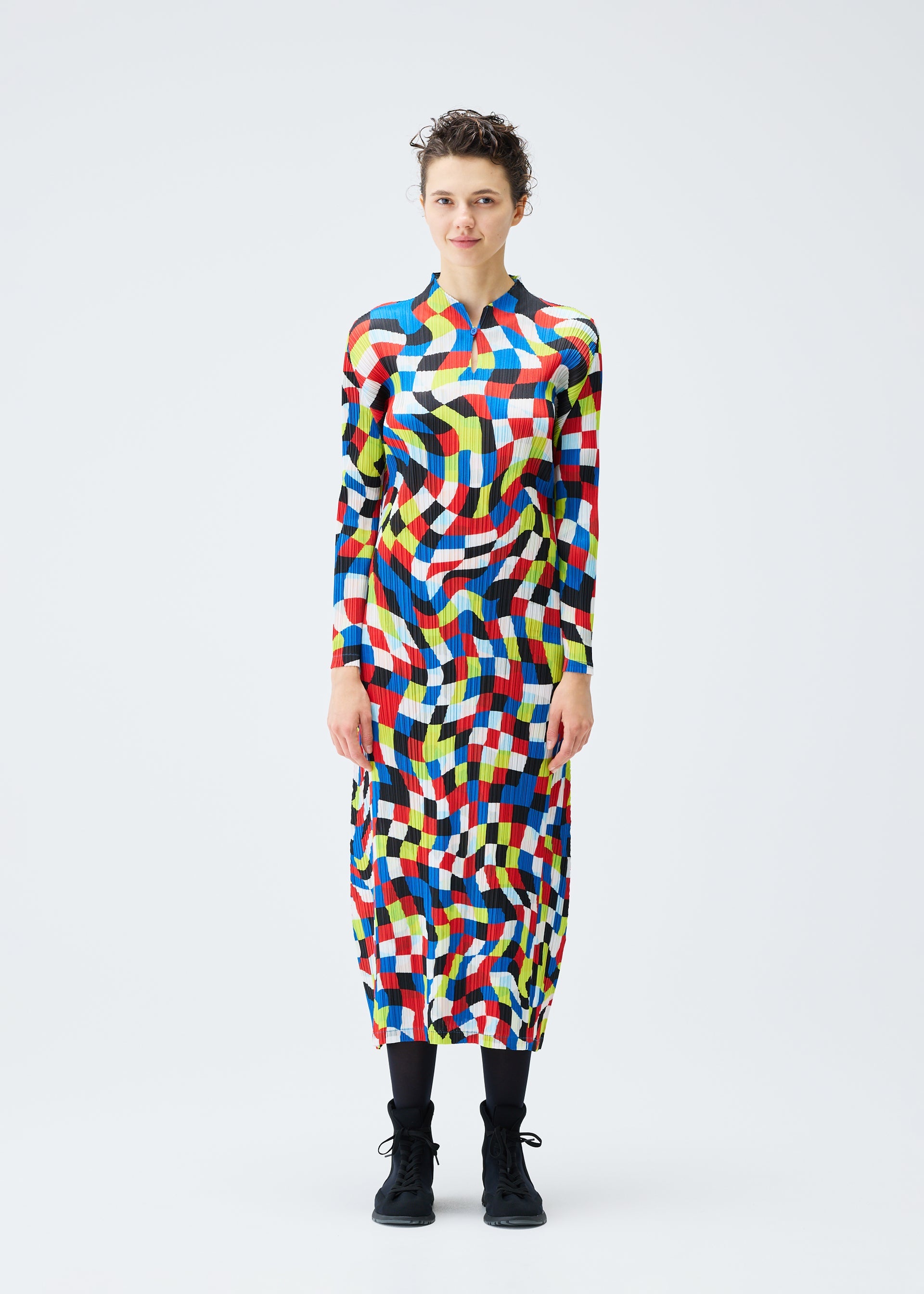 A model wears the PLEATS PLEASE ISSEY MIYAKE DANCING SQUARE dress.