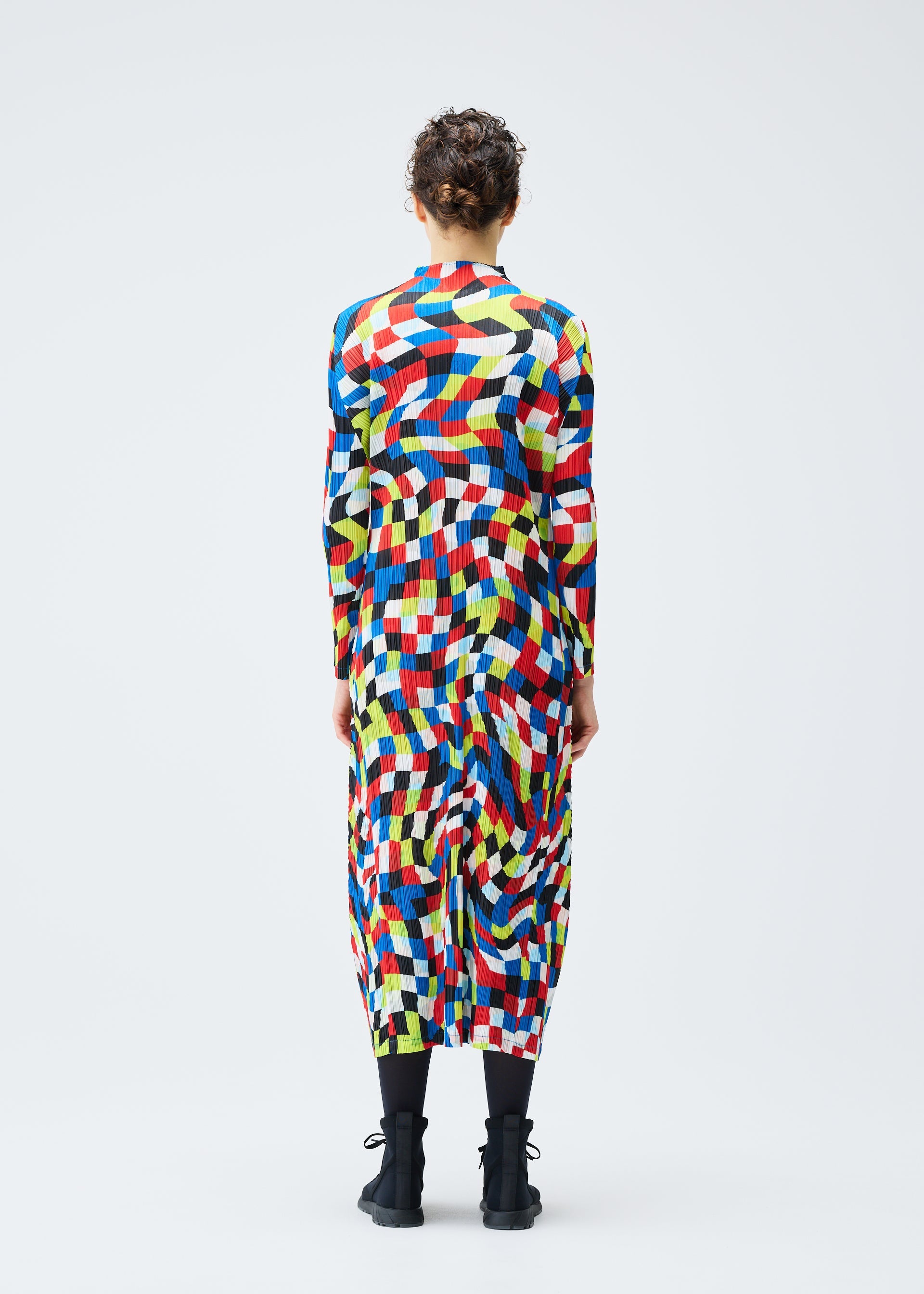 A model wears the PLEATS PLEASE ISSEY MIYAKE DANCING SQUARE dress.
