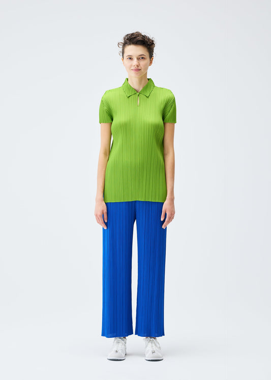 A model wears the PLEATS PLEASE ISSEY MIYAKE MONTHLY COLORS AUGUST top.