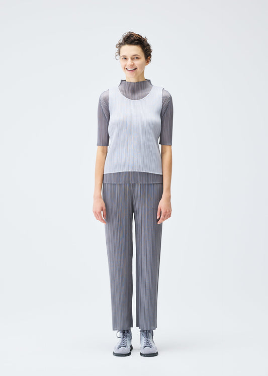 A model wears the PLEATS PLEASE ISSEY MIYAKE LUCID PLEATS top.