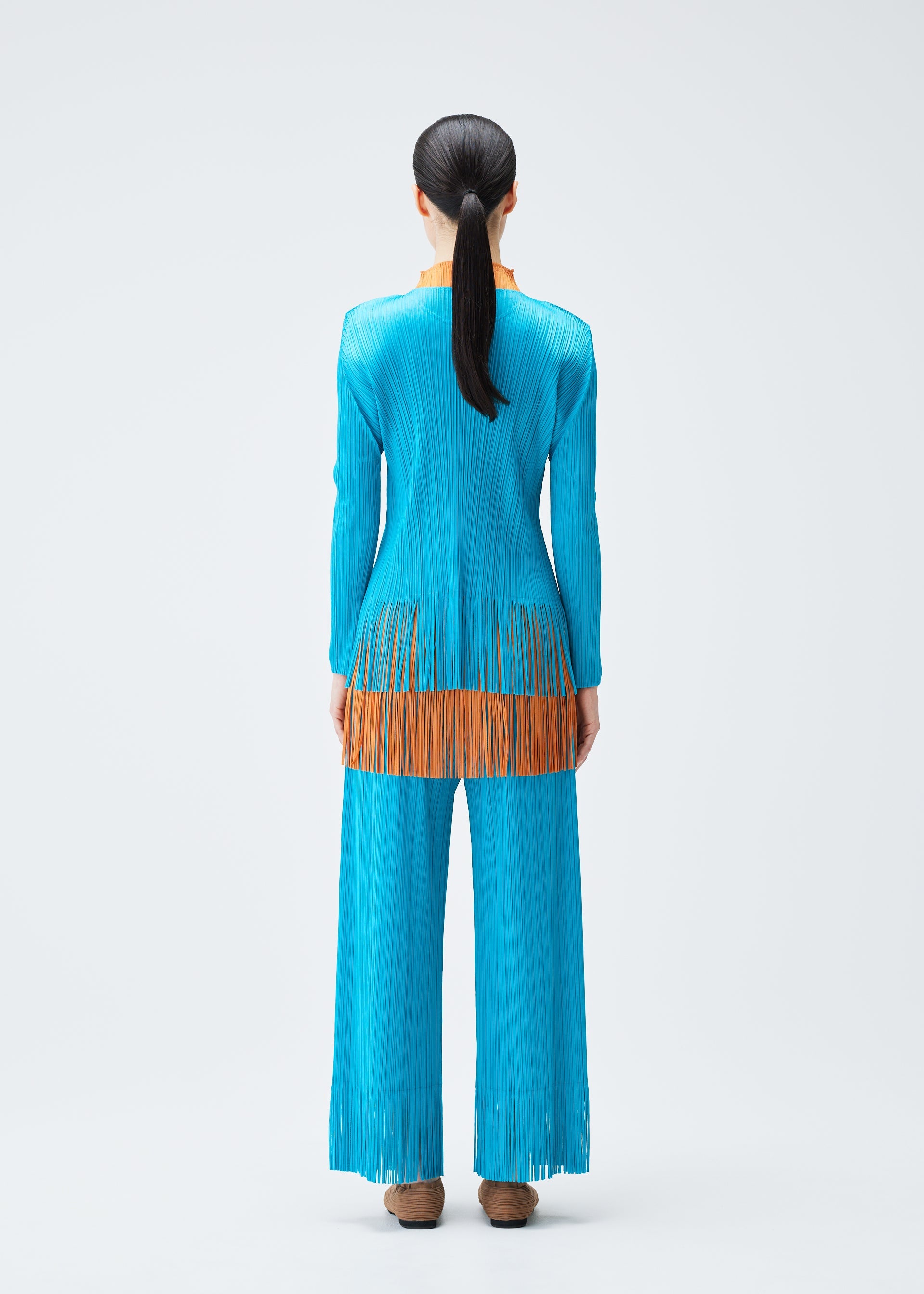 A model wears the PLEATS PLEASE ISSEY MIYAKE WAVE top.