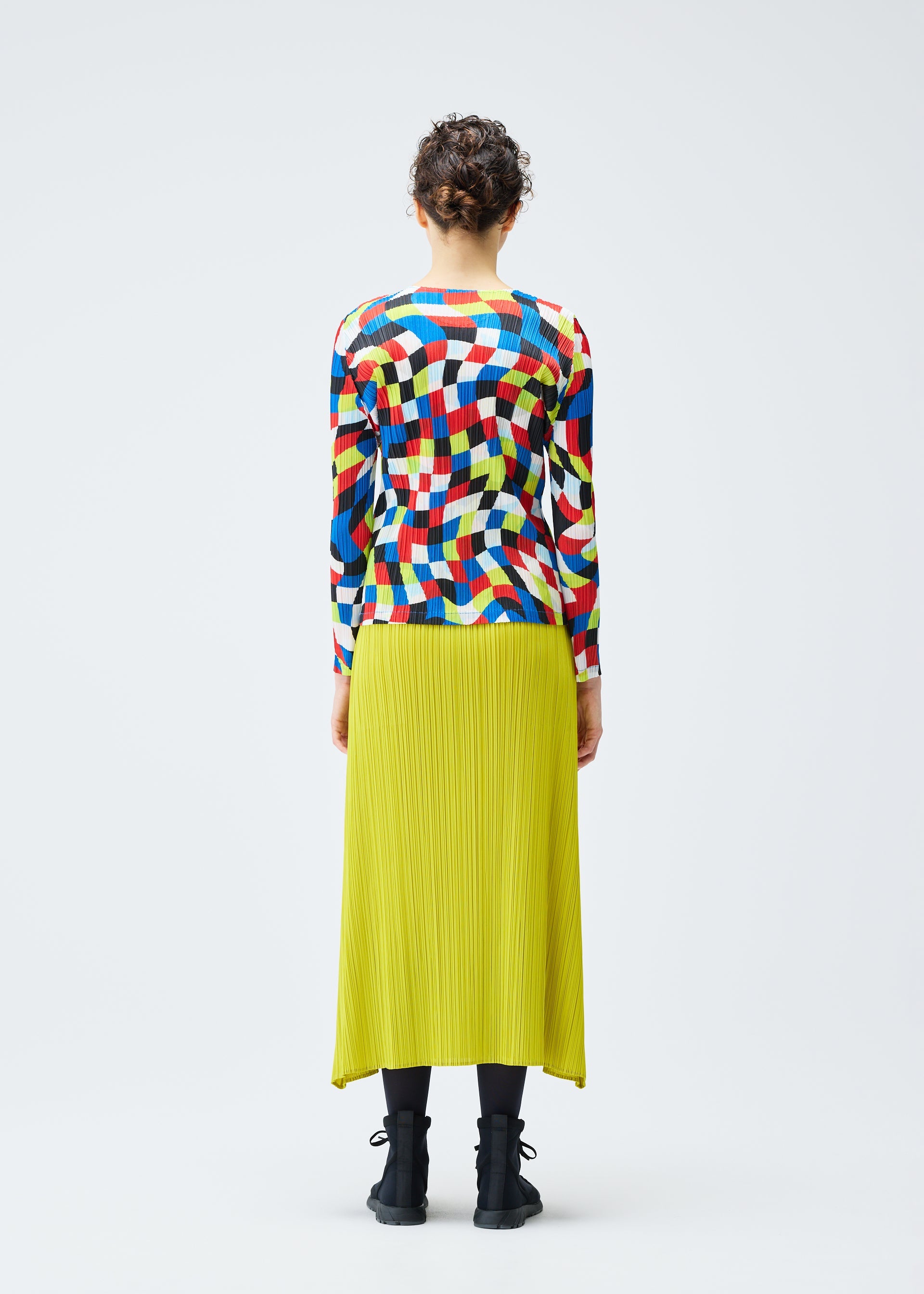 A model wears the PLEATS PLEASE ISSEY MIYAKE DANCING SQUARE top.