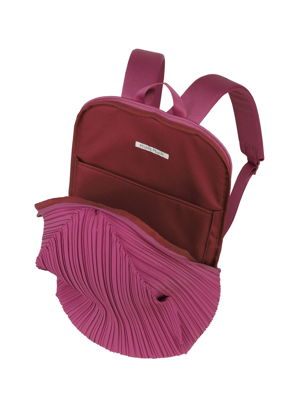 A detail shot of the PLEATS PLEASE ISSEY MIYAKE OVAL PLEATS BACKPACK bag.