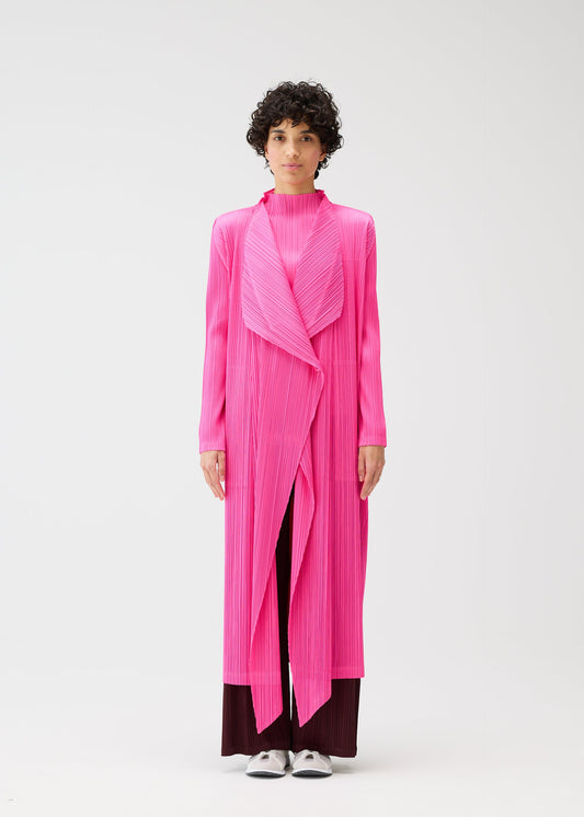 A model wears the PLEATS PLEASE ISSEY MIYAKE MONTHLY COLORS JANUARY clothing.