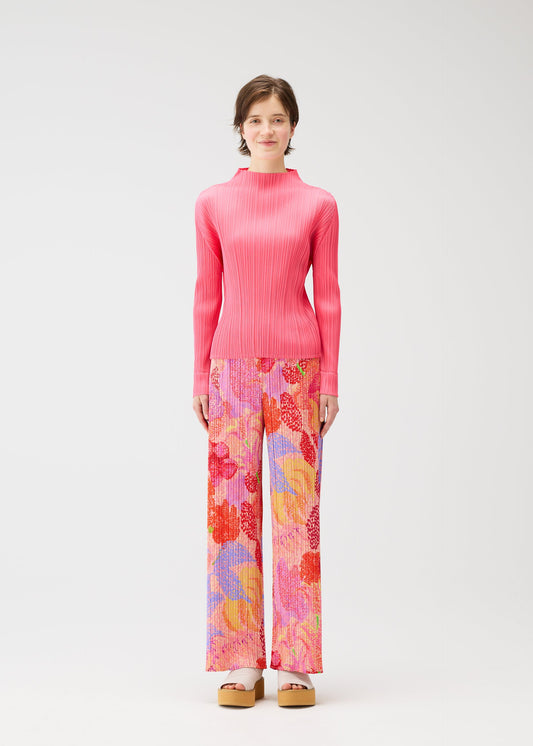 A model wears the PLEATS PLEASE ISSEY MIYAKE FOGGY FOREST trousers.