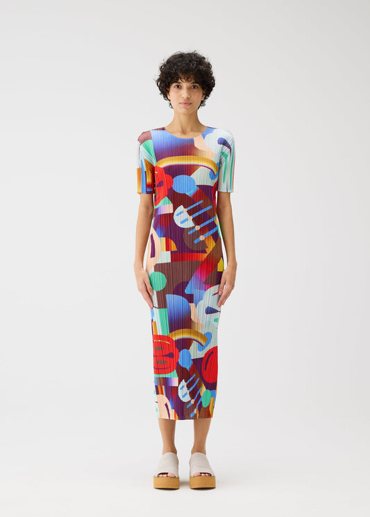 A model wears the PLEATS PLEASE ISSEY MIYAKE PLAYGROUND dress.