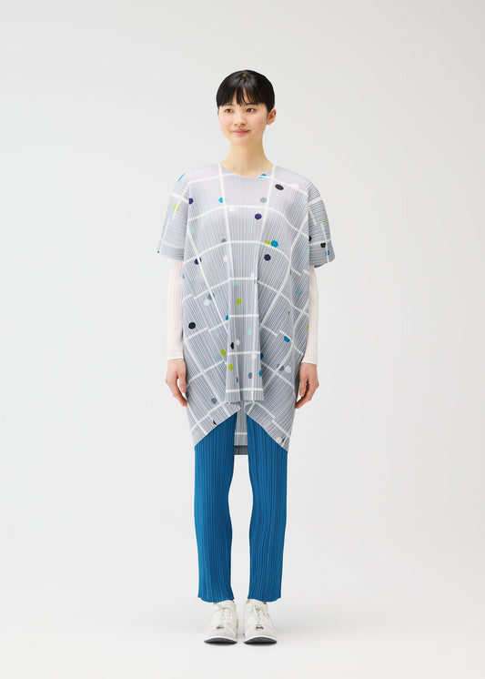 A model wears the PLEATS PLEASE ISSEY MIYAKE CROSSING DOTS dress.