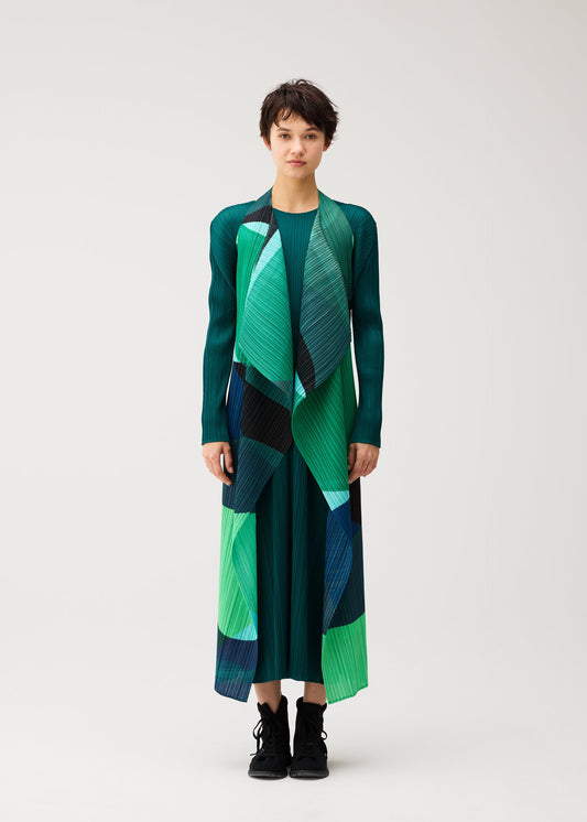 A model wears the PLEATS PLEASE ISSEY MIYAKE ORBIT orbit-vest-yellow.
