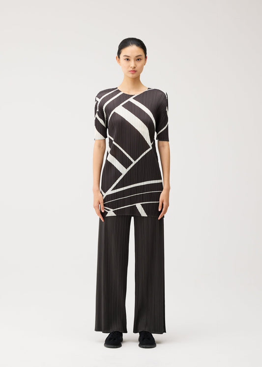A model wears the PLEATS PLEASE ISSEY MIYAKE FOLD LINE fold-line-tunic-off-white.