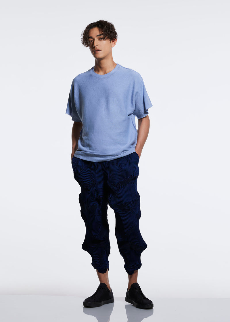 A model wears the A POC ABLE ISSEY MIYAKE  TYPE O 003 2 trousers