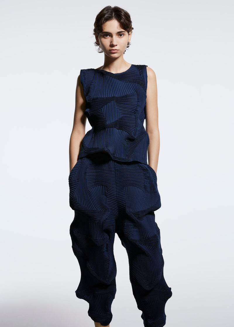 A model wears the A POC ABLE ISSEY MIYAKE  TYPE O 003 2 trousers