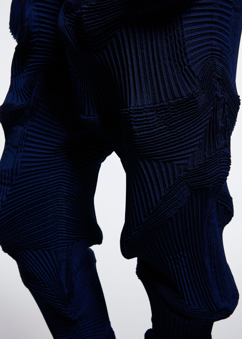 A model wears the A POC ABLE ISSEY MIYAKE  TYPE O 003 2 trousers