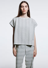 A model wears the A POC ABLE ISSEY MIYAKE  TYPE B 001 top