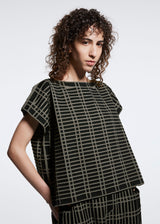 A model wears the A POC ABLE ISSEY MIYAKE  TYPE B 001 top