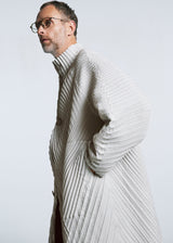 A model wears the A-POC ABLE ISSEY MIYAKE TYPE O 013 coat.