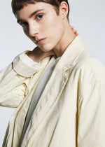 A model wears the A-POC ABLE ISSEY MIYAKE TYPE U 001 jacket.
