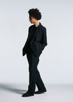 A model wears the A-POC ABLE ISSEY MIYAKE TYPE U 001 jacket.