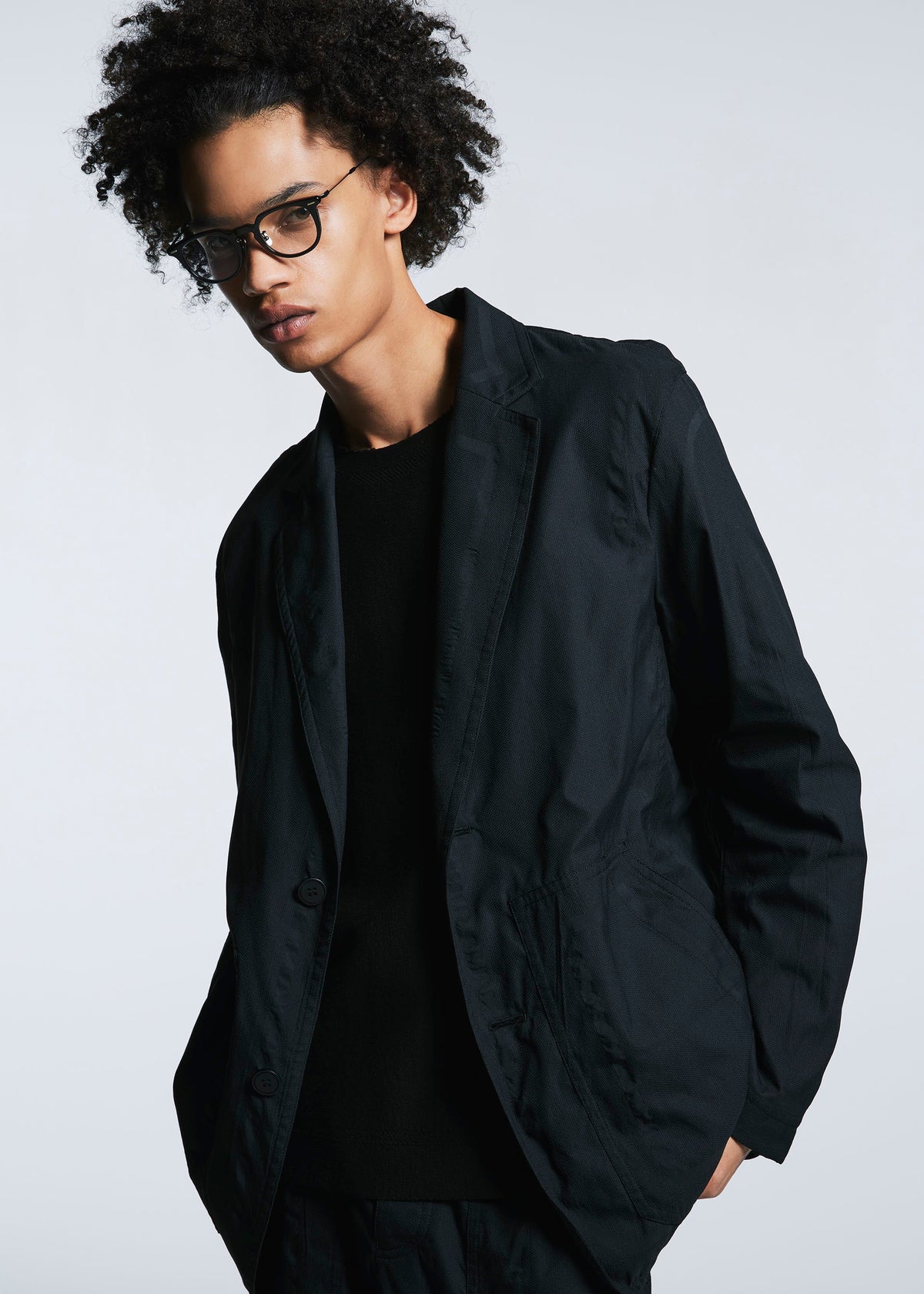 A model wears the A-POC ABLE ISSEY MIYAKE TYPE U 001 jacket.