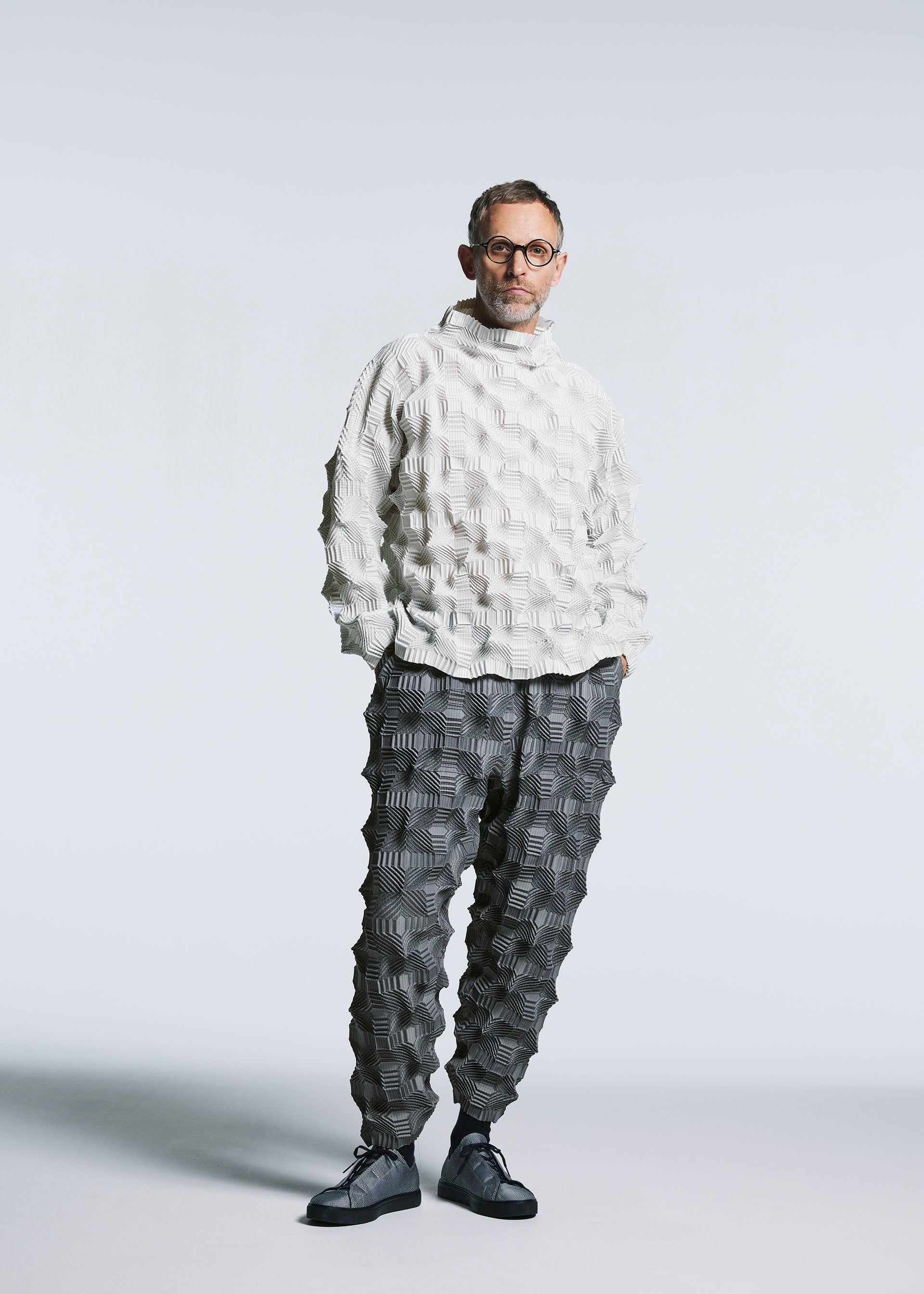 A model wears the A-POC ABLE ISSEY MIYAKE TYPE O 016 trousers.