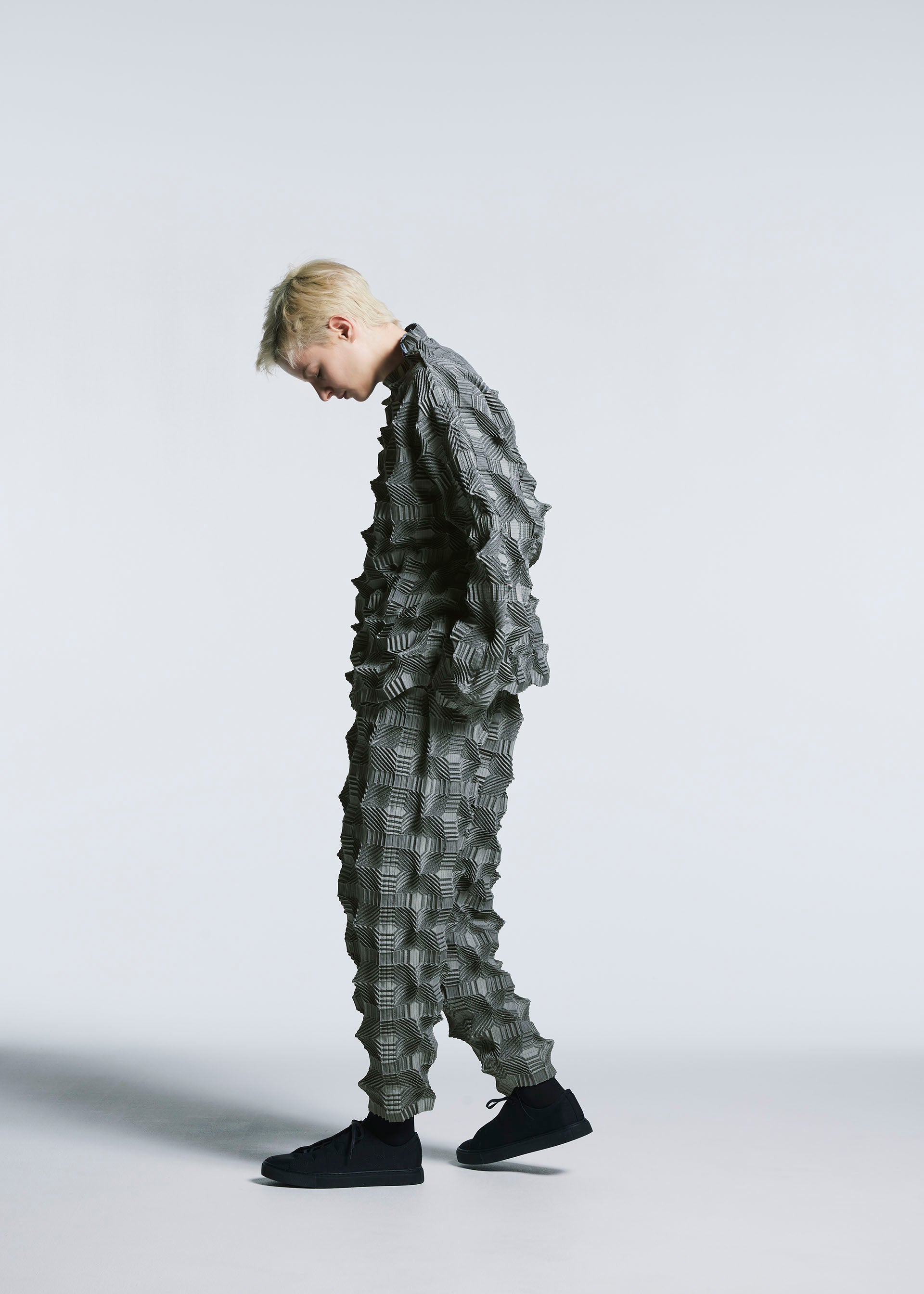 A model wears the A-POC ABLE ISSEY MIYAKE TYPE O 016 trousers.