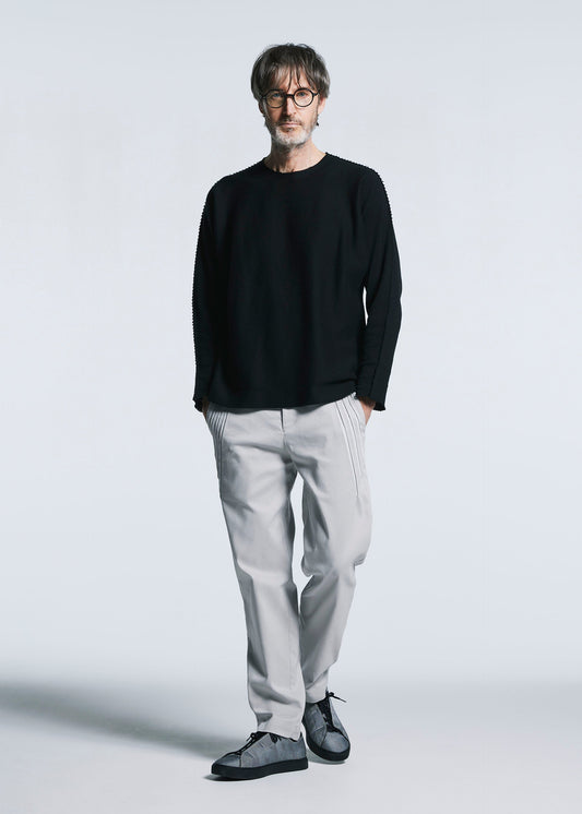 A model wears the A-POC ABLE ISSEY MIYAKE TYPE C 003 trousers.