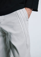 A model wears the A-POC ABLE ISSEY MIYAKE TYPE C 003 trousers.