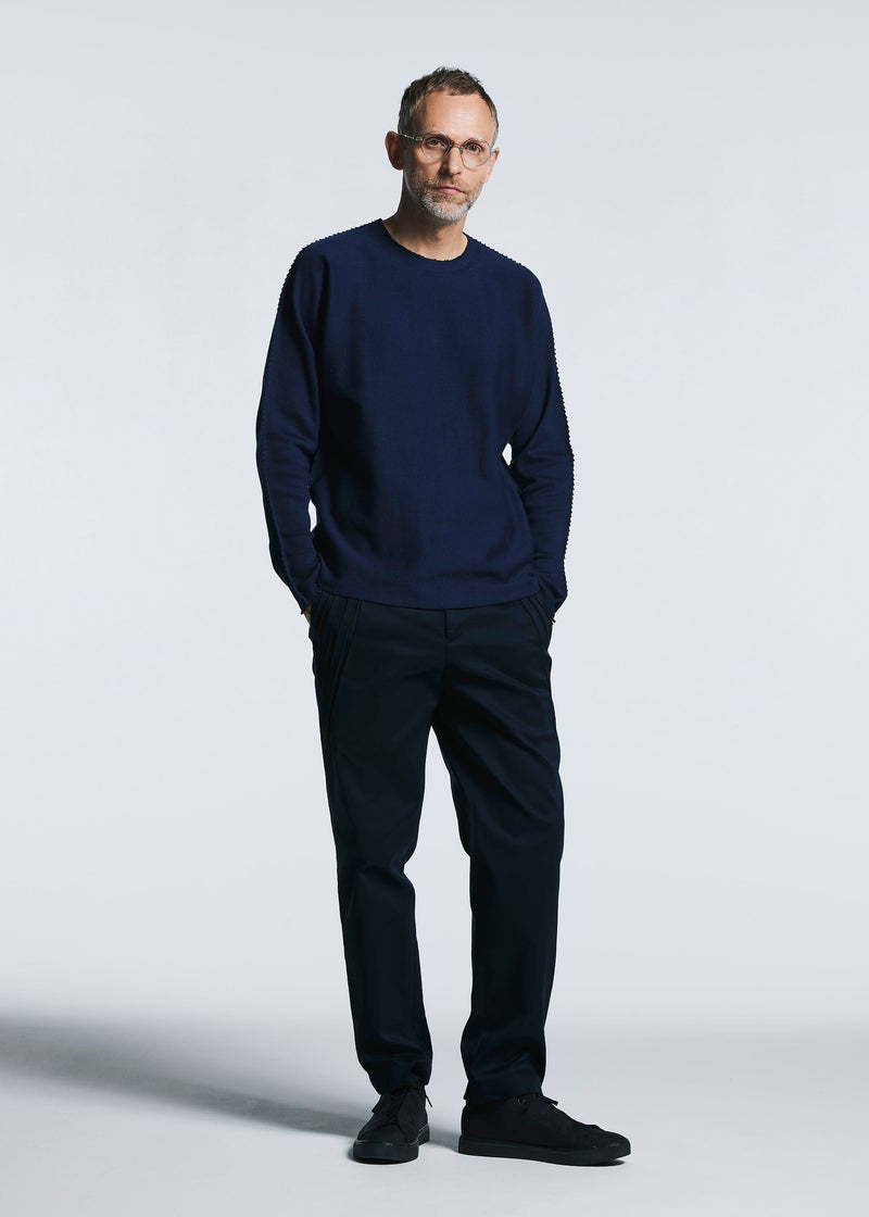 A model wears the A-POC ABLE ISSEY MIYAKE TYPE C 003 trousers.