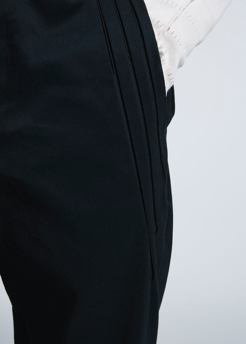 A model wears the A-POC ABLE ISSEY MIYAKE TYPE C 003 trousers.