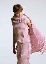 A model wears the A-POC ABLE ISSEY MIYAKE TYPE O STOLE stole.