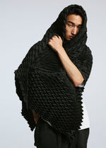 A model wears the A-POC ABLE ISSEY MIYAKE TYPE O STOLE stole.
