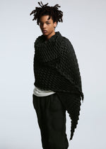 A model wears the A-POC ABLE ISSEY MIYAKE TYPE O STOLE stole.