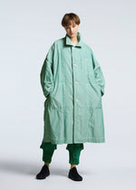 A model wears the A-POC ABLE ISSEY MIYAKE TYPE U 002 coat.