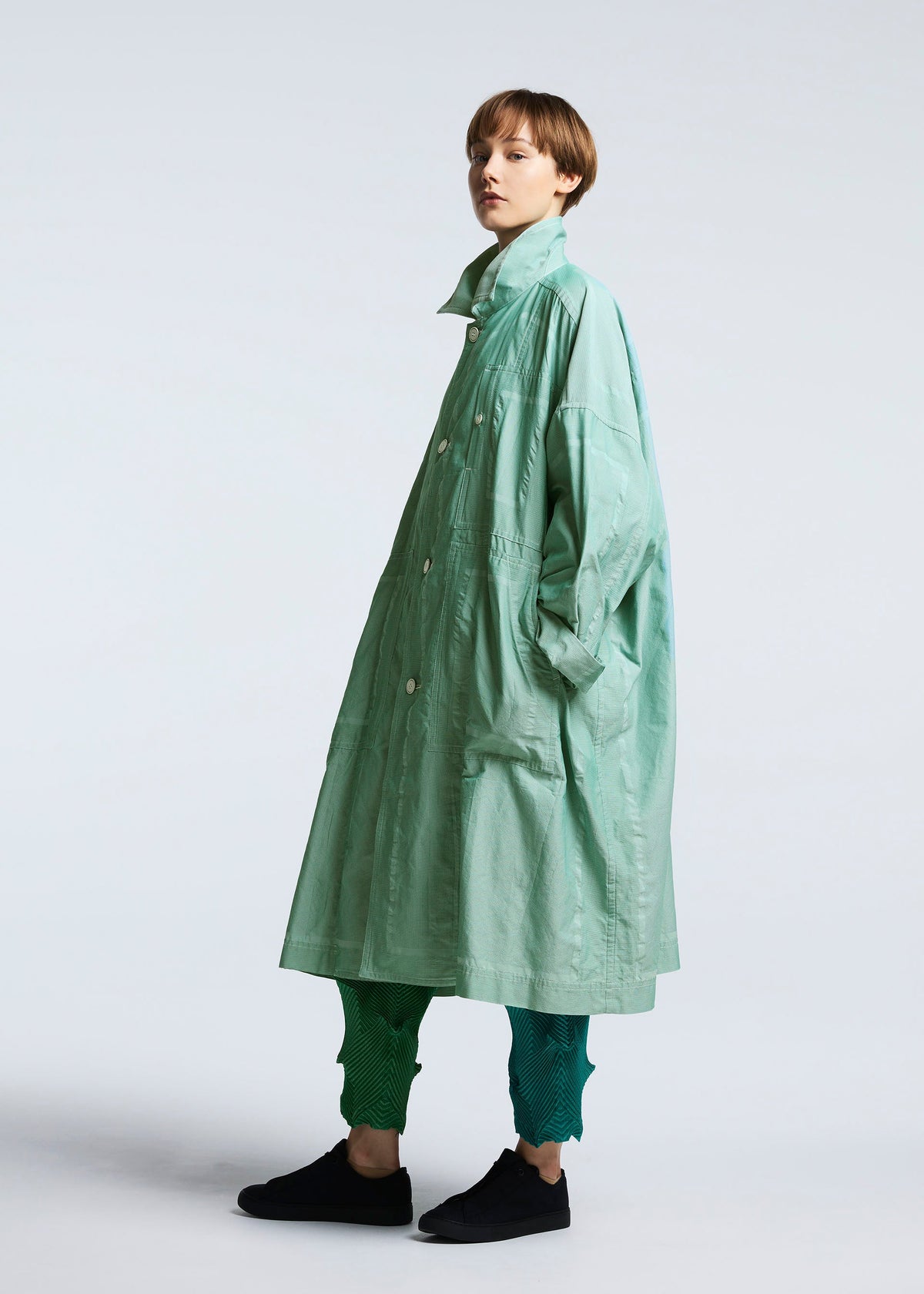 A model wears the A-POC ABLE ISSEY MIYAKE TYPE U 002 coat.