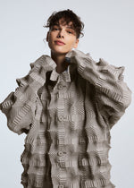 A model wears the A-POC ABLE ISSEY MIYAKE TYPE O 016 jacket.