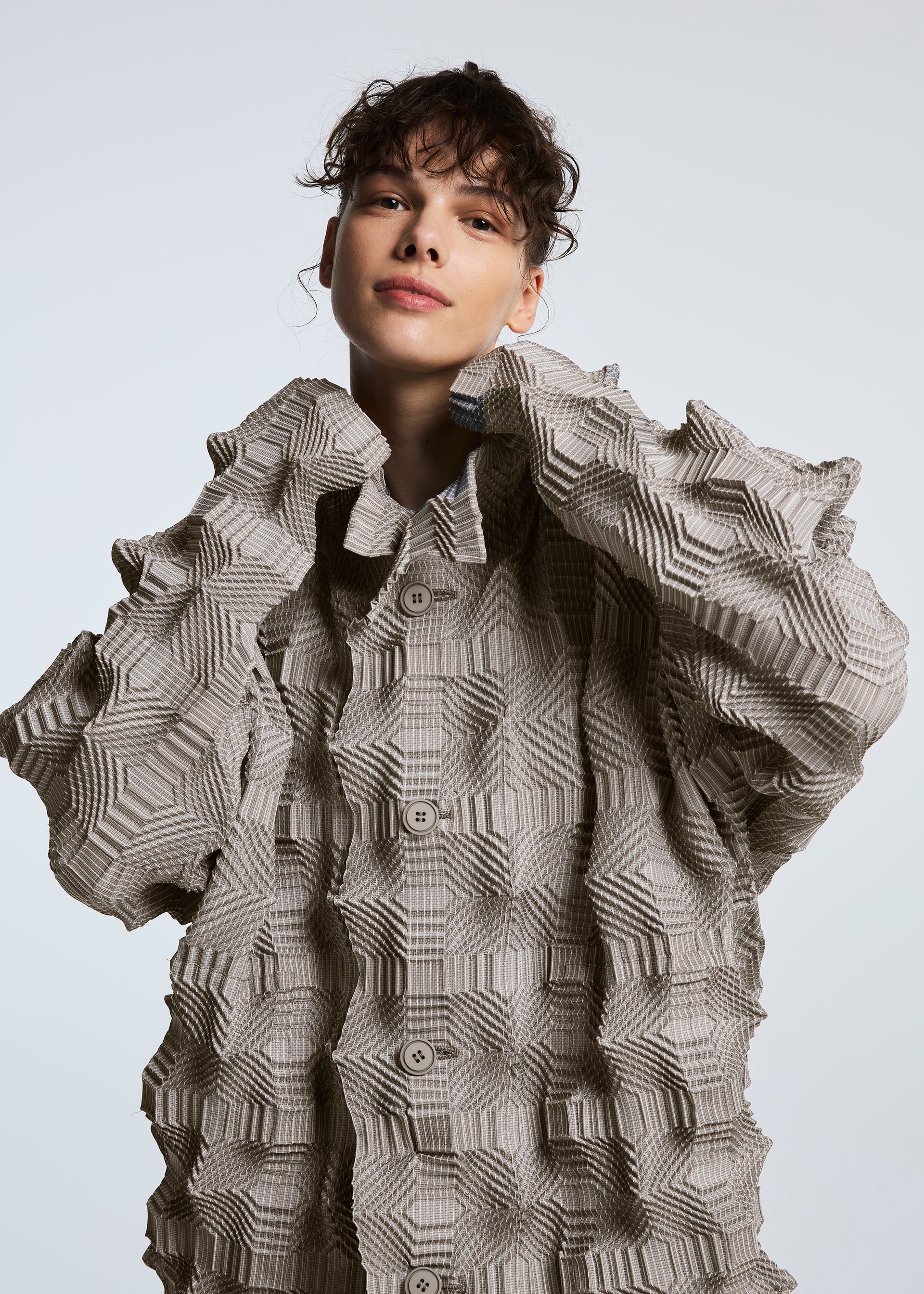 A model wears the A-POC ABLE ISSEY MIYAKE TYPE O 016 jacket.