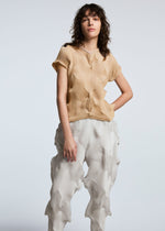 A model wears the A-POC ABLE ISSEY MIYAKE TYPE O 010 trousers.