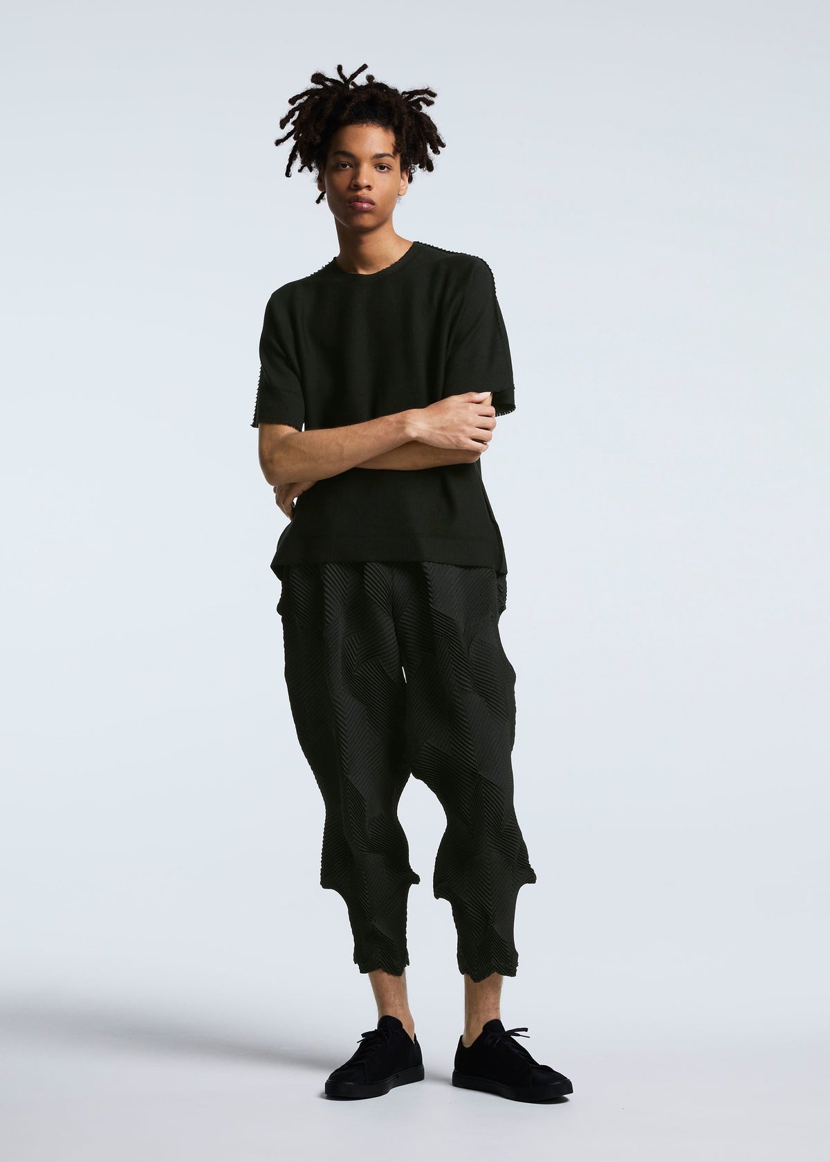 A model wears the A-POC ABLE ISSEY MIYAKE TYPE O 010 trousers.