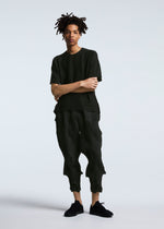 A model wears the A-POC ABLE ISSEY MIYAKE TYPE O 010 trousers.
