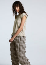 A model wears the A-POC ABLE ISSEY MIYAKE TYPE O 016 trousers.