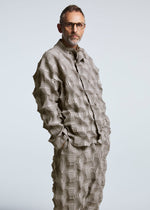 A model wears the A-POC ABLE ISSEY MIYAKE TYPE O 016 trousers.