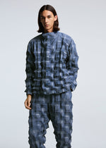 A model wears the A-POC ABLE ISSEY MIYAKE TYPE O 016 trousers.