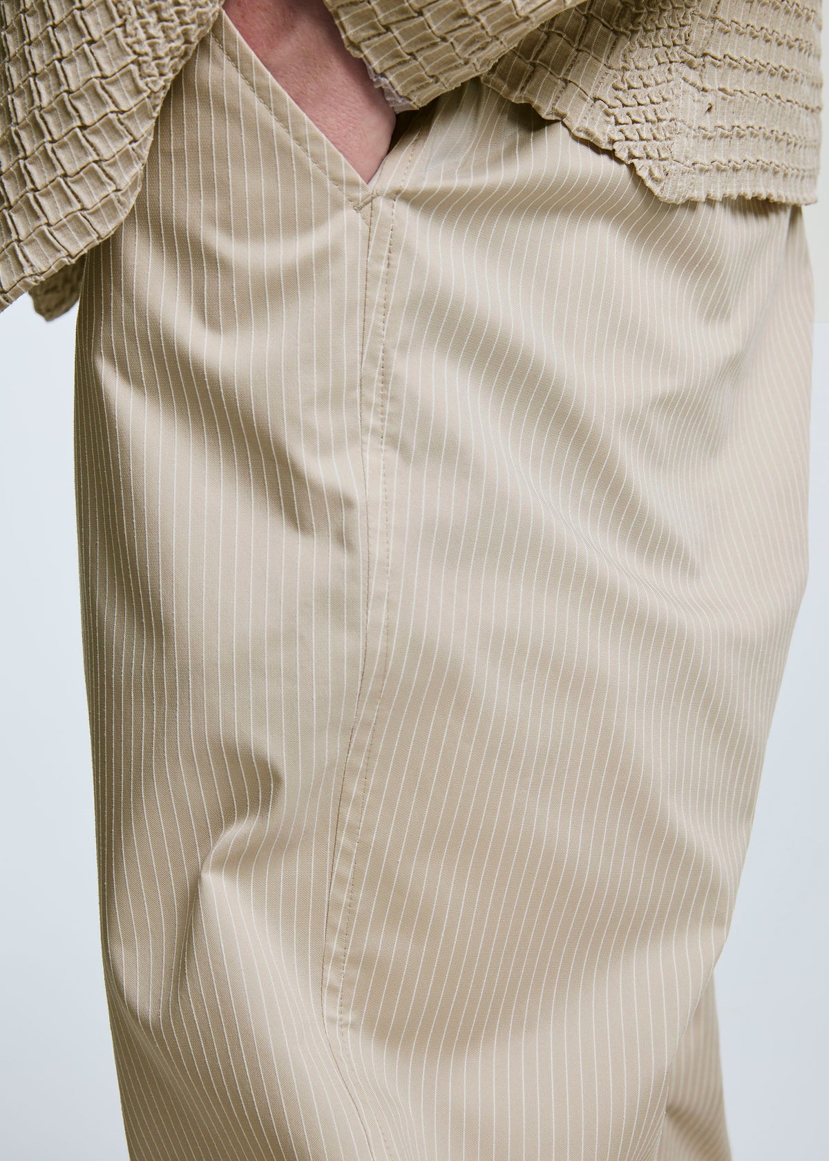 A model wears the A-POC ABLE ISSEY MIYAKE TYPE S 003 trousers.